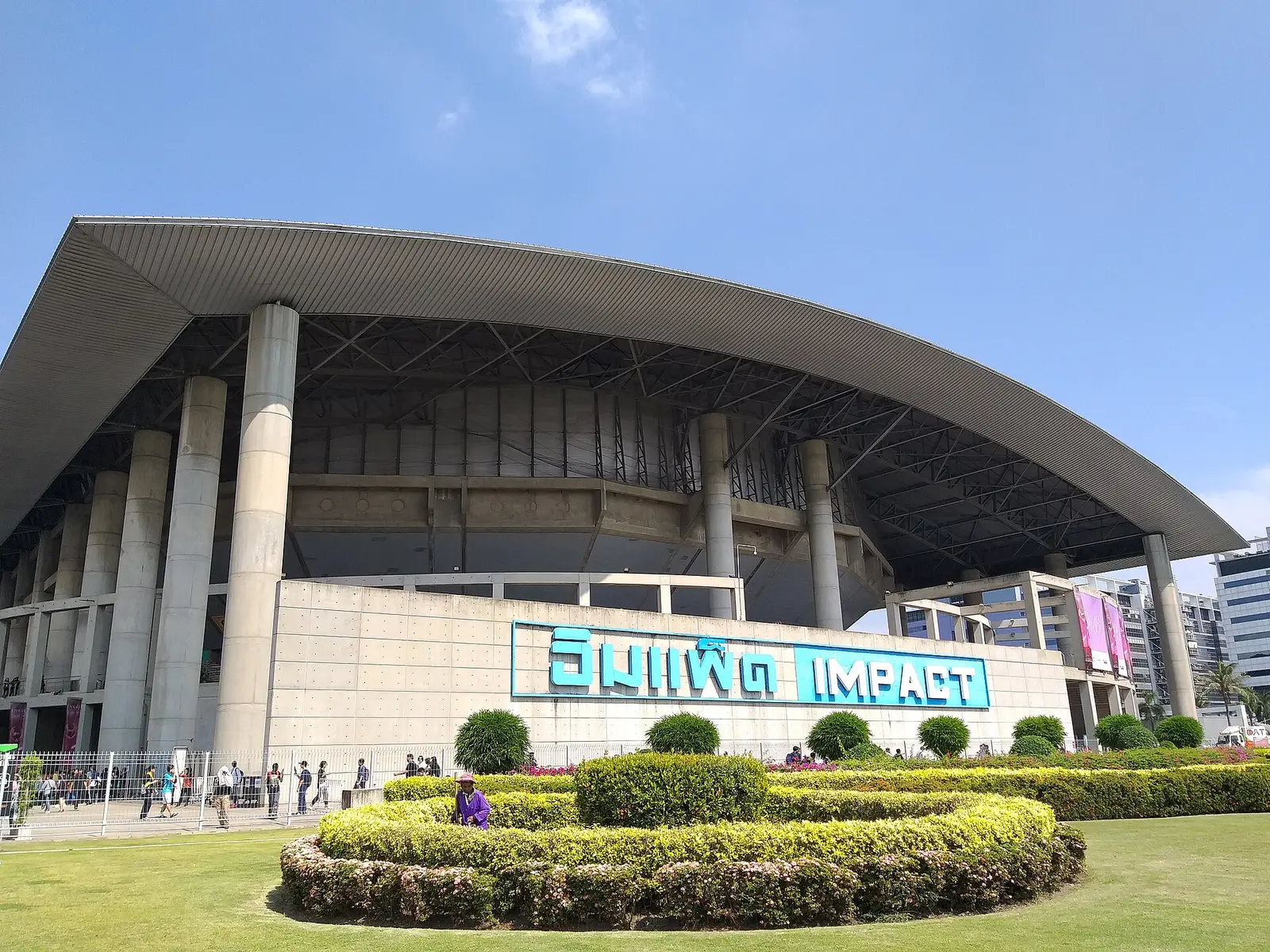 Impact Arena at Muang Thong Thani with a sweeping roof and landscaped garden in front