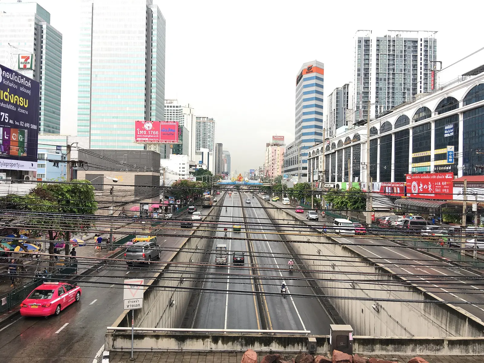 Ratchadaphisek Road in Bangkok at the Sutthisan intersection with towers and busy traffic lanes